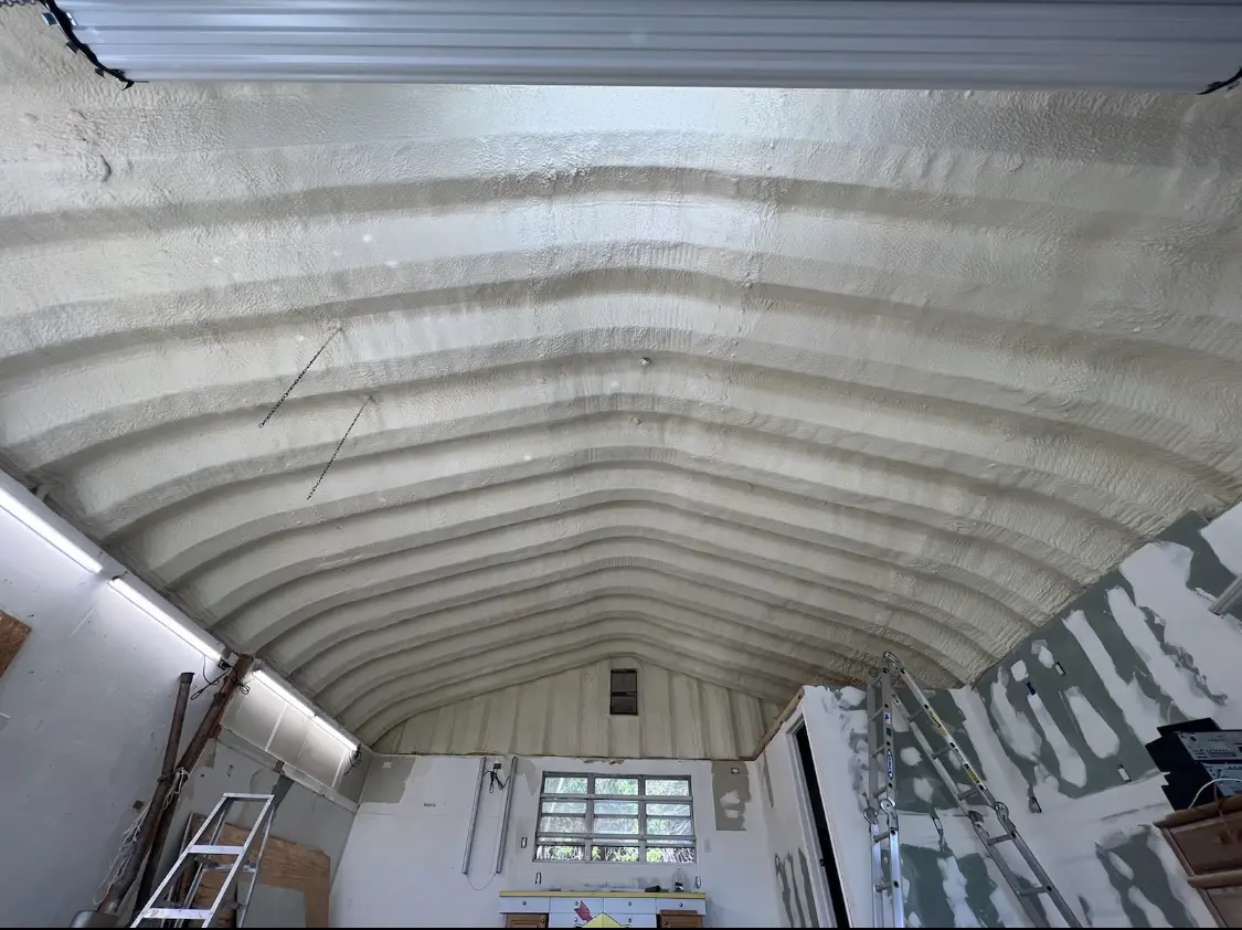 Spray polyurethane foam applied to the underside of a metal roof deck in Rockford